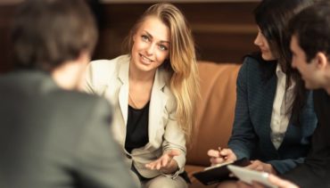 blonde woman explains something in her CEO