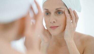 woman with blue eyes and towels after the bath